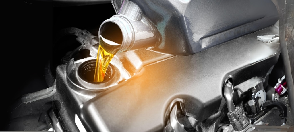 How often should you change your oil in Palmerston, ON? CDP Diesel and Auto, Inc. Image of new oil being poured into vehicle engine in the shop for oil change.