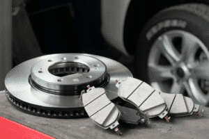 Brake pad and rotor replacement, auto repair in Palmerston, ON at CDP Diesel & Auto INC. Image of new brake pads and a brake rotor ready for installation to support safe, reliable braking.