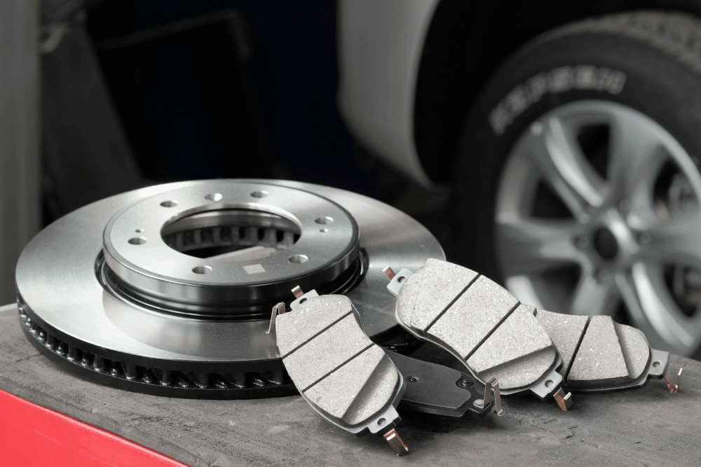 Brake pad and rotor replacement, auto repair in Palmerston, ON at CDP Diesel & Auto INC. Image of new brake pads and a brake rotor ready for installation to support safe, reliable braking.